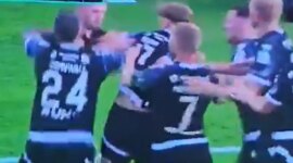 Crazy!: a fan jumps onto the field to attack the players after a penalty