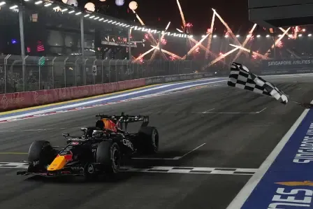 Red Bull driver Max Verstappen of the Netherlands crosses the finish line to win the Singapore Formula One Grand Prix race in Singapore, Sunday, Oct. 11, 2026. (AP Photo/Ng Han Guan, Pool)